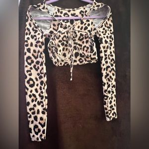 One of my favorite pieces . A crop leopard print with back tie strap down